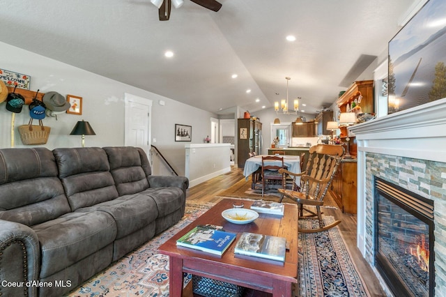 307 S 18th St, Coeur Dalene, ID 83814 - living area with light wood-type flooring, lofted ceiling, a chandelier, ceiling fan, and recessed lighting