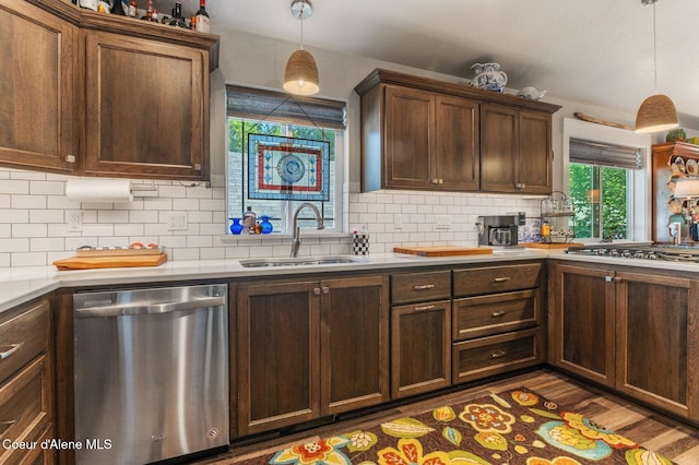 307 S 18th St, Coeur Dalene, ID 83814 - kitchen featuring stainless steel appliances, tasteful backsplash, light countertops, and hanging light fixtures