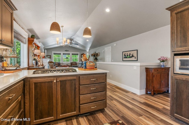307 S 18th St, Coeur Dalene, ID 83814 - kitchen featuring stainless steel gas stovetop, dark wood-type flooring, lofted ceiling, a ceiling fan, and light countertops