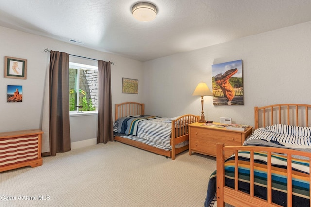 307 S 18th St, Coeur Dalene, ID 83814 - bedroom with carpet flooring and baseboards