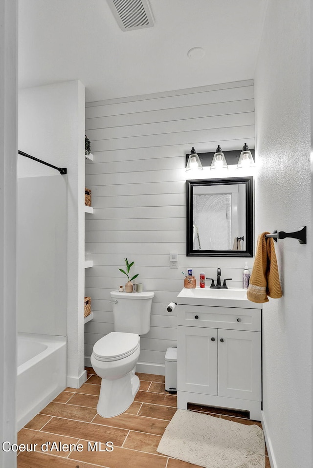 959 N Rutledge Ct, Coeur Dalene, ID 83814 - bathroom with vanity, wood finish floors, and shower / washtub combination