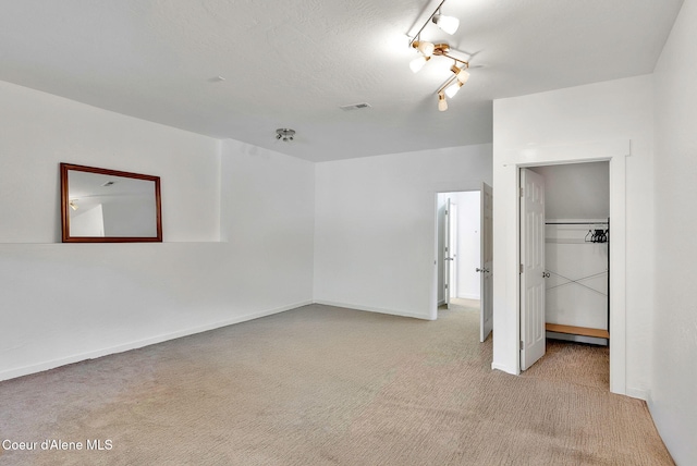 959 N Rutledge Ct, Coeur Dalene, ID 83814 - unfurnished bedroom featuring light colored carpet, a closet, and a spacious closet