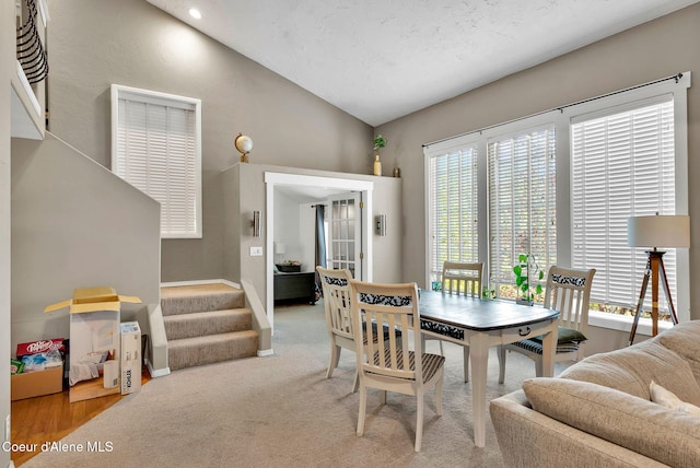 959 N Rutledge Ct, Coeur Dalene, ID 83814 - dining area with healthy amount of natural light, vaulted ceiling, stairs, and french doors