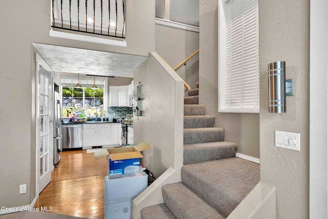 959 N Rutledge Ct, Coeur Dalene, ID 83814 - staircase featuring wood finished floors and baseboards