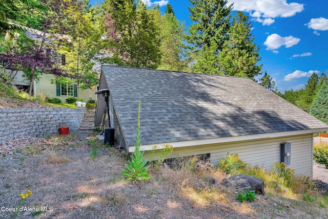 959 N Rutledge Ct, Coeur Dalene, ID 83814 - view of property exterior with roof with shingles and stairway