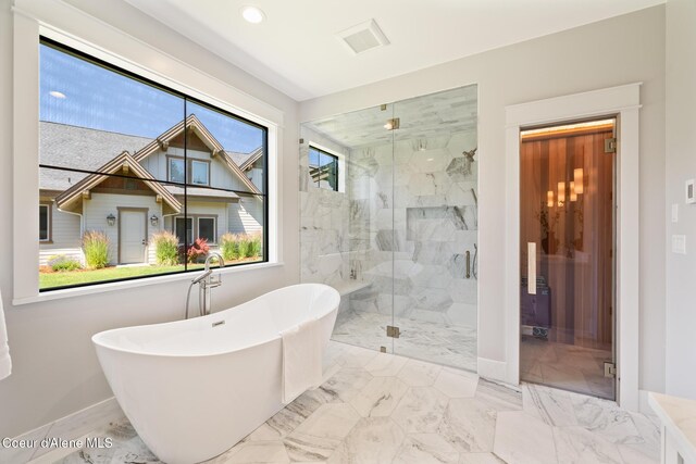 11551 N Bluejay Loop, Hayden, ID 83835 - bathroom featuring a soaking tub, a marble finish shower, marble finish floors, and recessed lighting