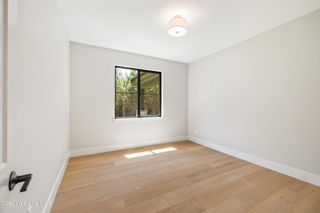 11551 N Bluejay Loop, Hayden, ID 83835 - spare room featuring baseboards and light wood-type flooring