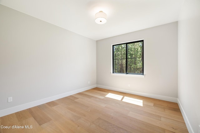 11551 N Bluejay Loop, Hayden, ID 83835 - empty room featuring baseboards and light wood-type flooring