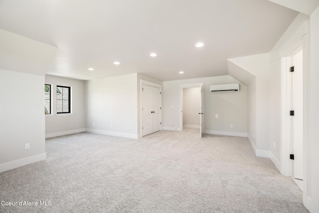 11551 N Bluejay Loop, Hayden, ID 83835 - additional living space featuring a wall mounted air conditioner, light colored carpet, and recessed lighting