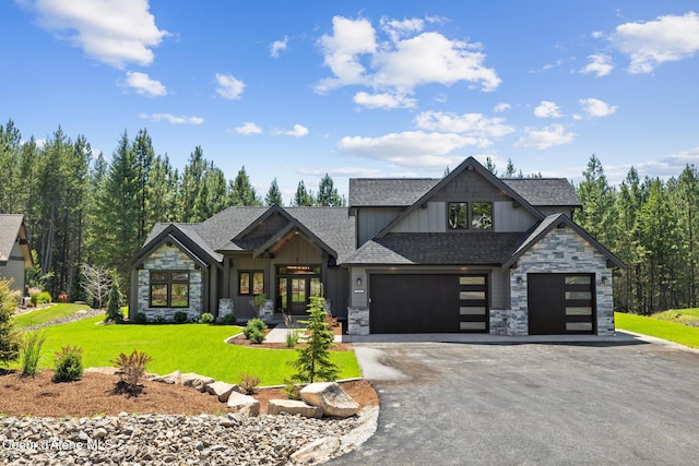 11551 N Bluejay Loop, Hayden, ID 83835 - view of front of house featuring stone siding, board and batten siding, asphalt driveway, and a front lawn