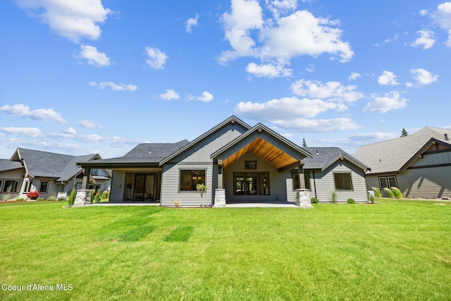 11551 N Bluejay Loop, Hayden, ID 83835 - rear view of property with a yard and a patio