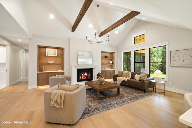 11551 N Bluejay Loop, Hayden, ID 83835 - living area featuring high vaulted ceiling, built in features, recessed lighting, light wood-style floors, and beam ceiling
