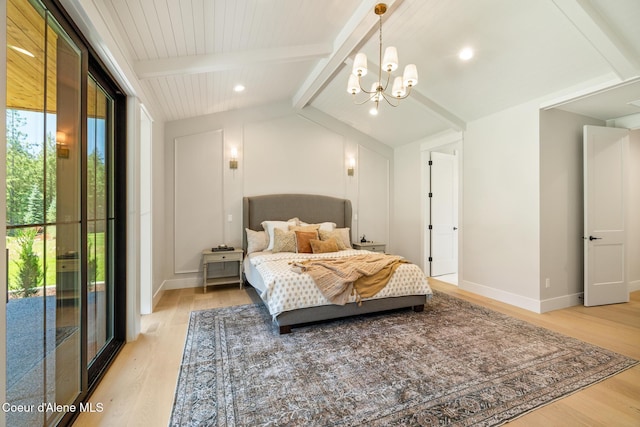 11551 N Bluejay Loop, Hayden, ID 83835 - bedroom with light wood-type flooring and a chandelier