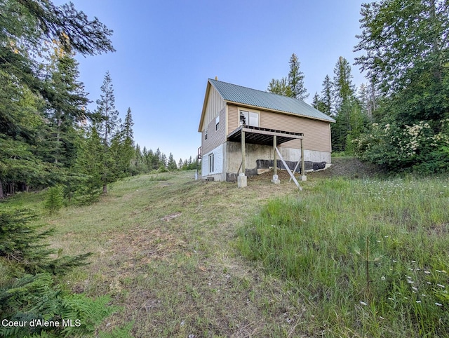 699 Granite Ridge Rd, Priest River, ID 83856 - rear view of house with a metal roof