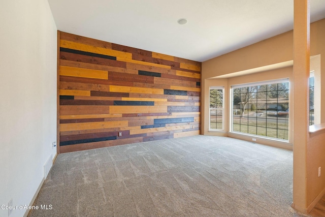 3206 N Lodgepole Rd, Coeur Dalene, ID 83815 - empty room featuring wood walls and carpet floors