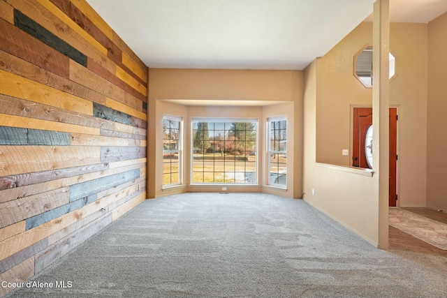 3206 N Lodgepole Rd, Coeur Dalene, ID 83815 - empty room with carpet and wood walls