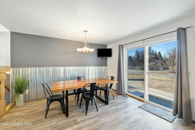 3206 N Lodgepole Rd, Coeur Dalene, ID 83815 - dining area featuring a chandelier and light wood finished floors