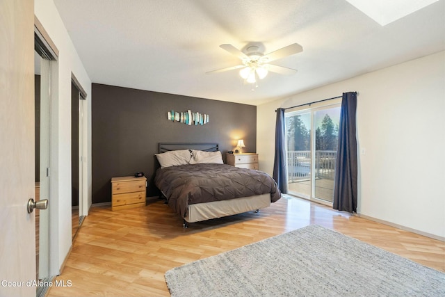 3206 N Lodgepole Rd, Coeur Dalene, ID 83815 - bedroom featuring access to exterior, light wood-style floors, and ceiling fan