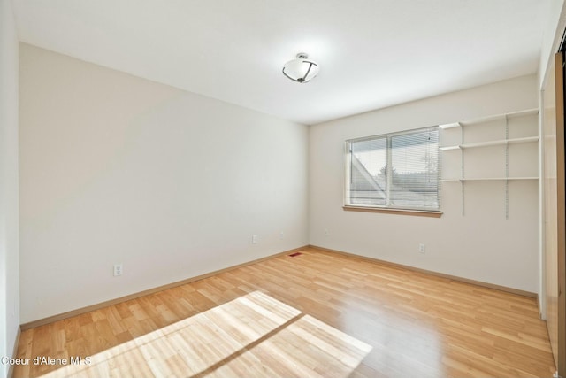 3206 N Lodgepole Rd, Coeur Dalene, ID 83815 - empty room featuring wood finished floors and baseboards