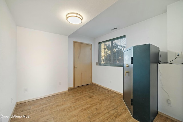 3206 N Lodgepole Rd, Coeur Dalene, ID 83815 - unfurnished room with light wood-style flooring and baseboards