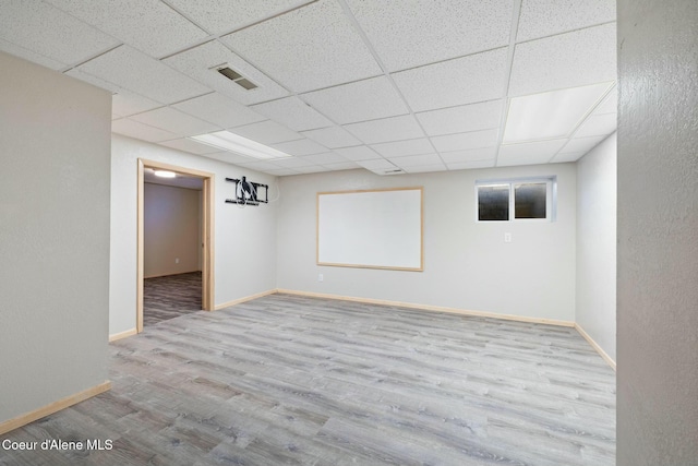 3206 N Lodgepole Rd, Coeur Dalene, ID 83815 - finished basement featuring wood finished floors and a paneled ceiling