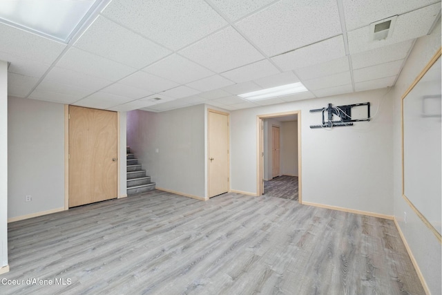 3206 N Lodgepole Rd, Coeur Dalene, ID 83815 - finished below grade area with light wood-style floors, stairs, and a drop ceiling