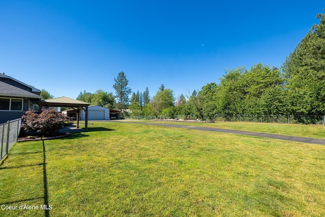 3206 N Lodgepole Rd, Coeur Dalene, ID 83815 - view of yard with a detached garage, an outbuilding, and driveway