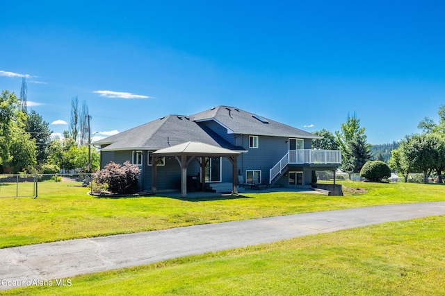 3206 N Lodgepole Rd, Coeur Dalene, ID 83815 - rear view of house with a gazebo, a deck, and stairway