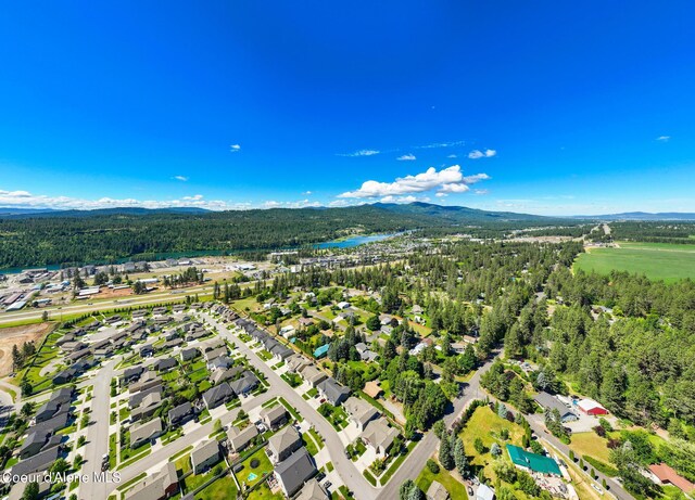 3206 N Lodgepole Rd, Coeur Dalene, ID 83815 - drone / aerial view of a water and mountain view and a forest