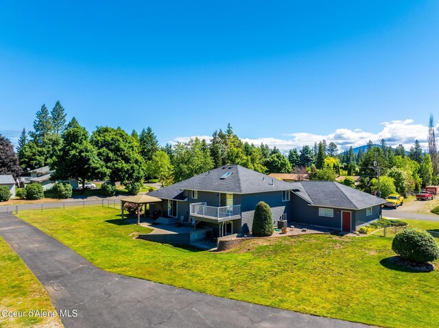 3206 N Lodgepole Rd, Coeur Dalene, ID 83815 - view of front of house with a shingled roof and a patio area