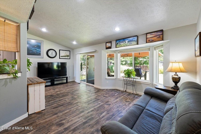 7315 W Lund St, Rathdrum, ID 83858 - living room featuring a textured ceiling, dark wood-style floors, vaulted ceiling, and recessed lighting