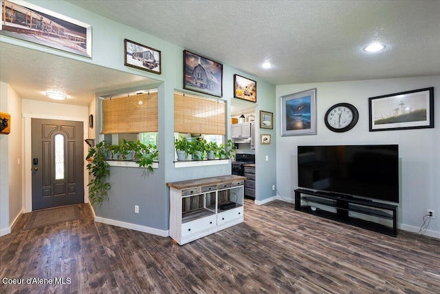 7315 W Lund St, Rathdrum, ID 83858 - living area with a textured ceiling, dark wood-style flooring, and recessed lighting