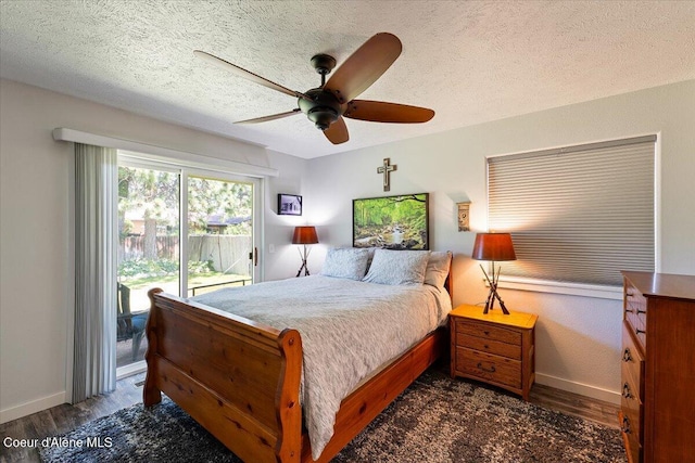 7315 W Lund St, Rathdrum, ID 83858 - bedroom featuring access to exterior, dark wood-type flooring, ceiling fan, and a textured ceiling