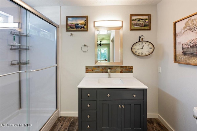 7315 W Lund St, Rathdrum, ID 83858 - full bathroom with wood finished floors, vanity, and a stall shower