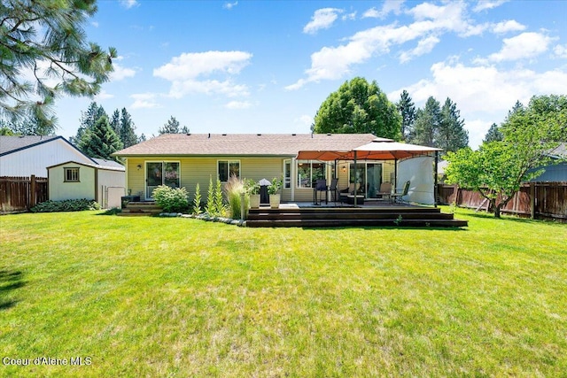 7315 W Lund St, Rathdrum, ID 83858 - rear view of property featuring a fenced backyard, a gazebo, and a deck