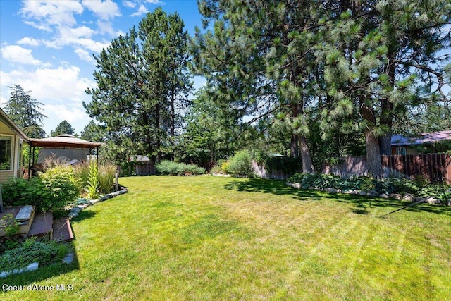7315 W Lund St, Rathdrum, ID 83858 - fenced backyard featuring a gazebo