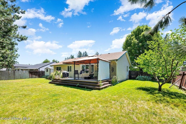 7315 W Lund St, Rathdrum, ID 83858 - back of property featuring a gazebo, a deck, and a fenced backyard