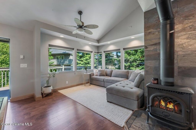5653 W Racquet Rd, Rathdrum, ID 83858 - living room with a wood stove, vaulted ceiling, ceiling fan, hardwood / wood-style floors, and recessed lighting