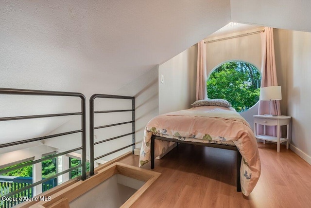 5653 W Racquet Rd, Rathdrum, ID 83858 - bedroom featuring wood finished floors and baseboards