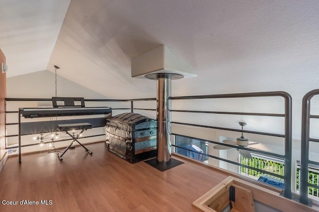 5653 W Racquet Rd, Rathdrum, ID 83858 - living area with wood finished floors and vaulted ceiling