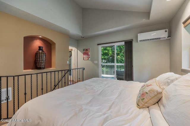5653 W Racquet Rd, Rathdrum, ID 83858 - bedroom with a wall mounted air conditioner, access to exterior, and lofted ceiling