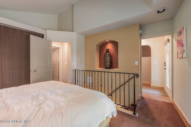 5653 W Racquet Rd, Rathdrum, ID 83858 - carpeted bedroom featuring arched walkways and baseboards