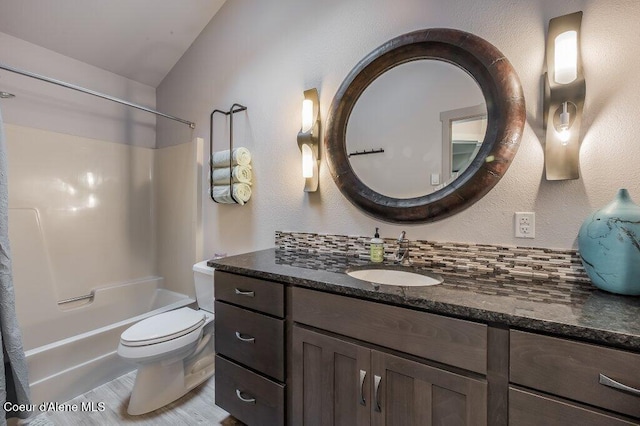 5653 W Racquet Rd, Rathdrum, ID 83858 - bathroom featuring vanity,  shower combination, wood finished floors, and a textured wall