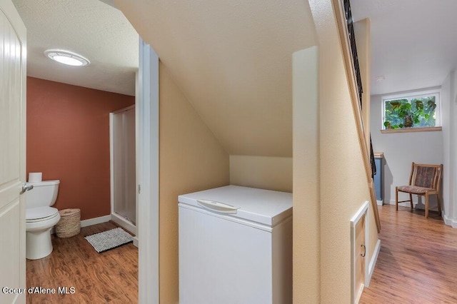 5653 W Racquet Rd, Rathdrum, ID 83858 - washroom featuring wood finished floors and baseboards