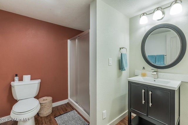 5653 W Racquet Rd, Rathdrum, ID 83858 - full bath with wood finished floors, vanity, and a stall shower