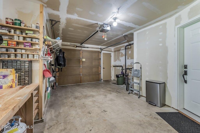 5653 W Racquet Rd, Rathdrum, ID 83858 - garage featuring a garage door opener