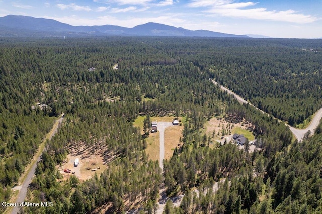 17320 E Perimeter Rd, Athol, ID 83801 - aerial view of property and surrounding area featuring a forest and a mountainous background