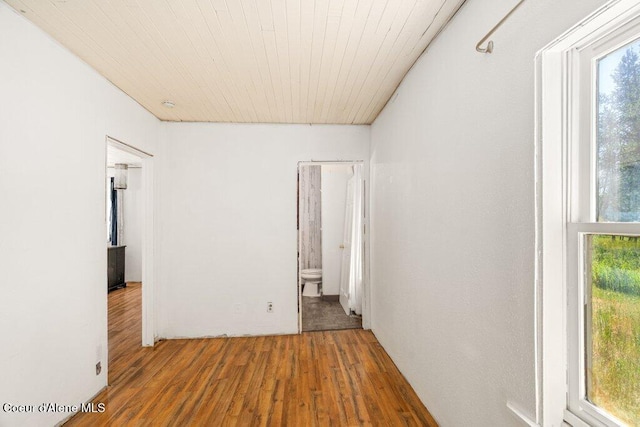 17320 E Perimeter Rd, Athol, ID 83801 - spare room with wood finished floors and wooden ceiling
