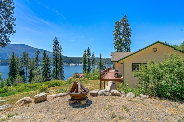 17544 E Arapaho Rd, Bayview, ID 83803 - view of yard featuring a deck with water view