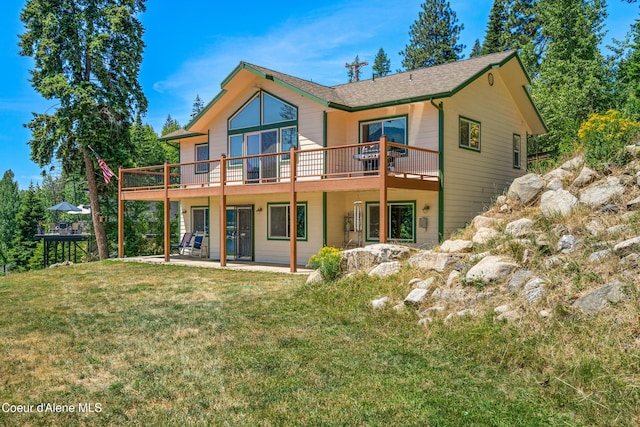 17544 E Arapaho Rd, Bayview, ID 83803 - rear view of property with a deck, a lawn, a patio area, and a shingled roof